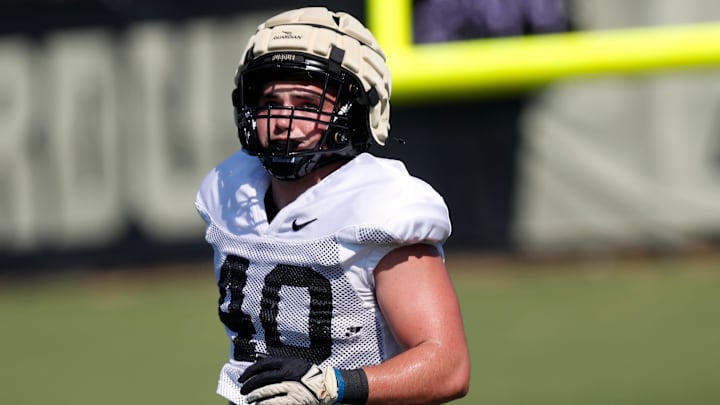 Purdue Boilermakers linebacker Hudson Miller (40) runs during football practice