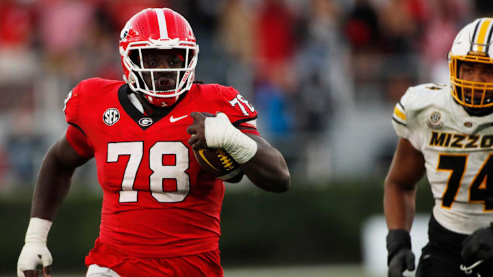 Georgia defensive lineman Nazir Stackhouse (78) returns the ball after making an interception that was later called back during the second half of a NCAA college football game against Missouri in Athens, Ga., on Saturday, Nov. 4, 2023. Georgia won 30-21.