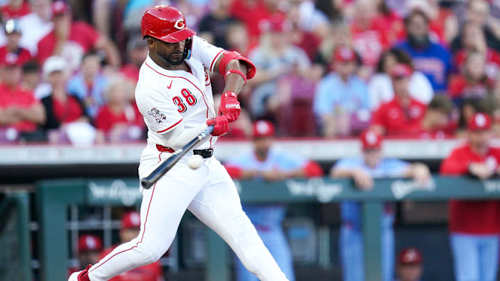 Cincinnati Reds designated hitter Miguel Andujar (38) hits a single in the first inning of a MLB game between the Cincinnati Reds and St. Louis Cardinals, Aug. 30, 2025, at Great American Ball Park in downtown Cincinnati.