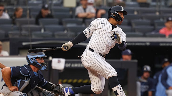 May 4, 2025; Bronx, New York, USA; New York Yankees second baseman Jorbit Vivas (90) hits a two RBI single during the eighth inning against the Tampa Bay Rays at Yankee Stadium. Mandatory Credit: Vincent Carchietta-Imagn Images