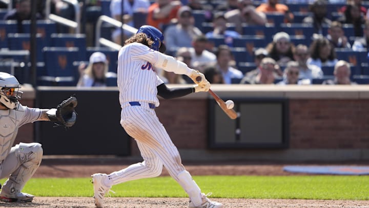 May 1, 2025; New York City, New York, USA; New York Mets designated hitter Jesse Winker (3) hits a double against the Arizona Diamondbacks during the eighth inning at Citi Field. Mandatory Credit: Gregory Fisher-Imagn Images