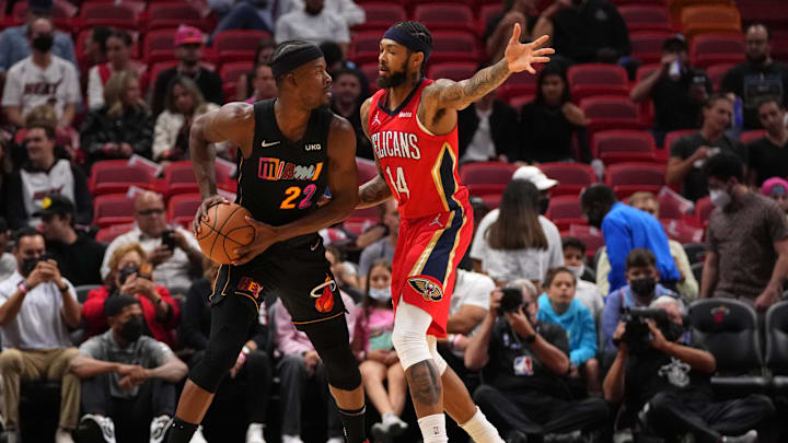 Nov 17, 2021; Miami, Florida, USA; Miami Heat forward Jimmy Butler (22) controls the ball around New Orleans Pelicans forward Brandon Ingram (14) during the first half at FTX Arena. Mandatory Credit: Jasen Vinlove-Imagn Images