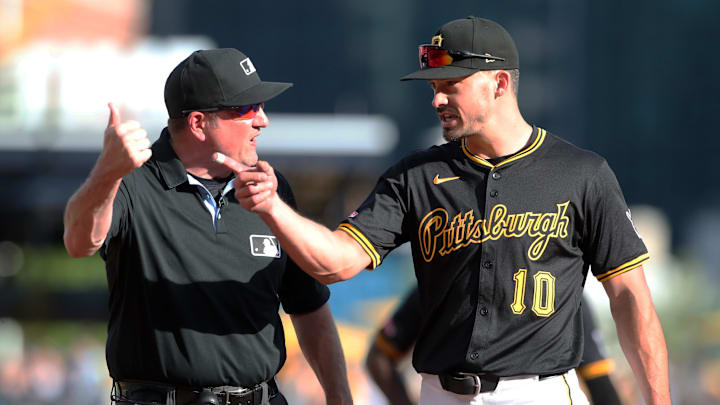 May 10, 2025; Pittsburgh, Pennsylvania, USA;  Third base umpire Dan Bellino (2) ejects Pittsburgh Pirates right fielder Bryan Reynolds (10) during the seventh inning against the Atlanta Braves at PNC Park. Mandatory Credit: Charles LeClaire-Imagn Images