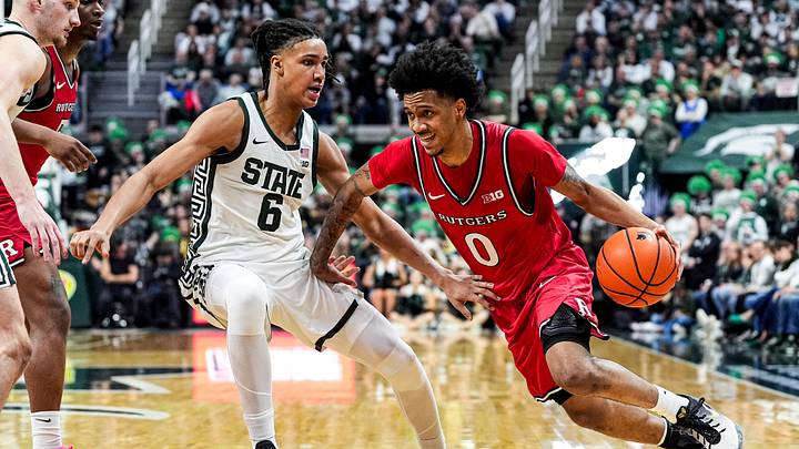 Rutgers guard Tariq Francis (0) dribbles against Michigan State forward Jordan Scott (6) during the first half at Breslin Center in East Lansing on Thursday, March 5, 2026. Rutgers guard Tariq Francis (0) dribbles against Michigan State forward Jordan Scott (6) during the first half at Breslin Center in East Lansing on Thursday, March 5, 2026.