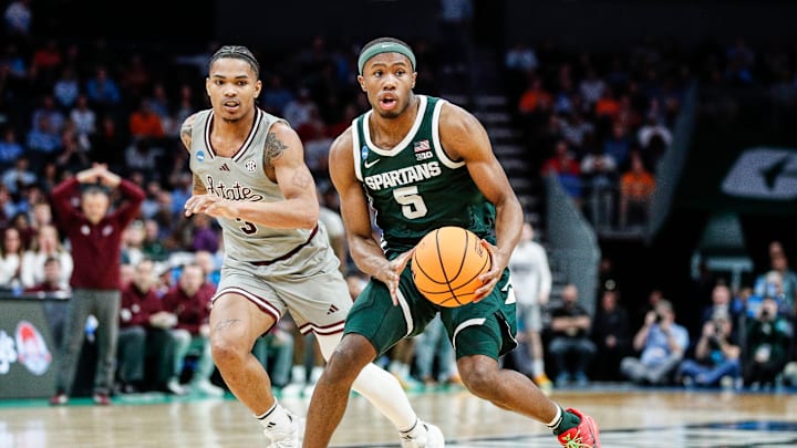 Michigan State guard Tre Holloman (5) looks to pass against Mississippi State guard Shakeel Moore