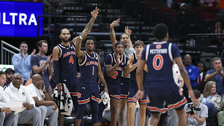 Nov 9, 2024; Houston, Texas, USA; Auburn Tigers bench players react after a basket by guard Tahaad Pettiford (0) during the second half against the Houston Cougars at Toyota Center. Mandatory Credit: Troy Taormina-Imagn Images
