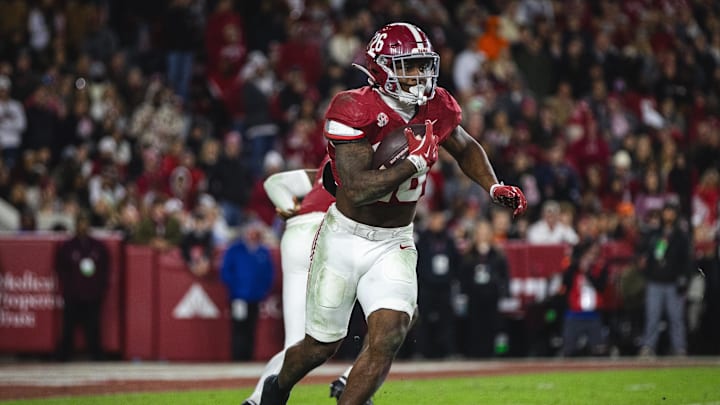 Nov 30, 2024; Tuscaloosa, Alabama, USA; Alabama Crimson Tide running back Jam Miller (26) runs the ball against the Auburn Tigers during the third quarter at Bryant-Denny Stadium. Nov 30, 2024; Tuscaloosa, Alabama, USA; Alabama Crimson Tide running back Jam Miller (26) runs the ball against the Auburn Tigers during the third quarter at Bryant-Denny Stadium.
