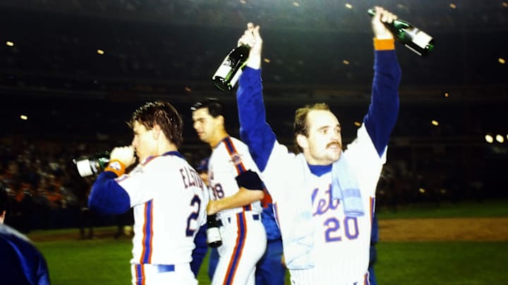 New York Mets Howard Johnson and Kevin Elster celebrate on the field after the Mets defeated the Boston Red Sox in game 7 of the 1986 World Series at Shea Stadium Oct. 27, 1986.