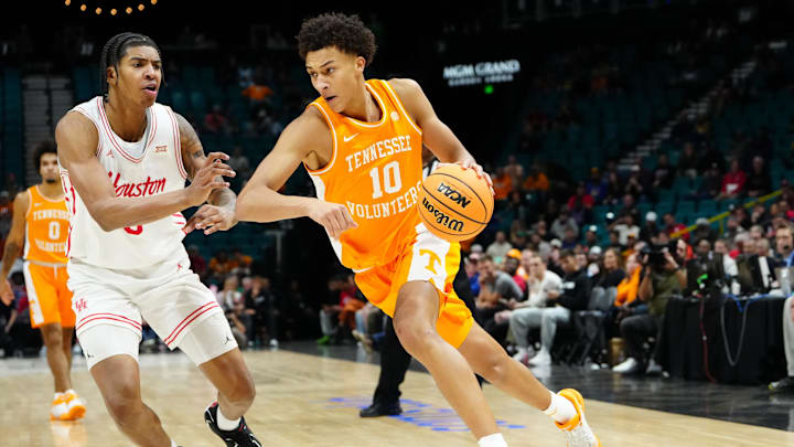 Nov 25, 2025; Las Vegas, NV, USA; Tennessee Volunteers forward Nate Ament (10) drives to the basket against Houston Cougars center Chris Cenac Jr. (5) in a 2025 Players Era Festival group play game during the second half at MGM Grand Garden Arena. Mandatory Credit: Stephen R. Sylvanie-Imagn Images