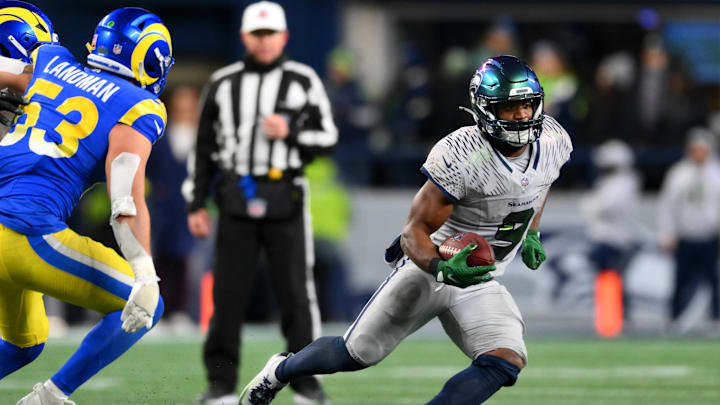 Dec 18, 2025; Seattle, Washington, USA; Seattle Seahawks running back Kenneth Walker III (9) runs against the Los Angeles Rams in overtime at Lumen Field. Mandatory Credit: Steven Bisig-Imagn Images