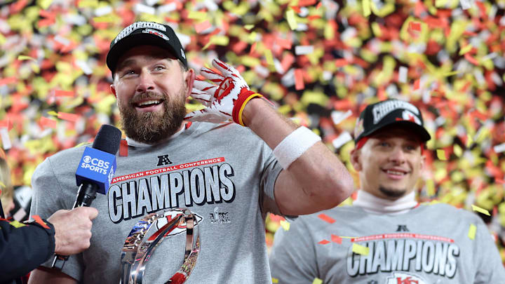 Jan 26, 2025; Kansas City, MO, USA; Kansas City Chiefs tight end Travis Kelce (87) reacts on stage after the AFC Championship game against the Buffalo Bills at GEHA Field at Arrowhead Stadium. Mandatory Credit: Mark J. Rebilas-Imagn Images