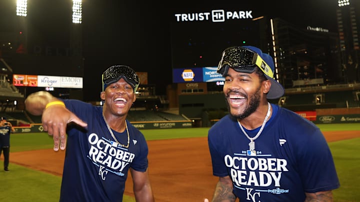 Sep 27, 2024; Atlanta, Georgia, USA; Kansas City Royals outfielder Dairon Blanco (44) and third baseman Maikel Garcia (11) celebrates after clinching a wild card playoff birth after a game against the Atlanta Braves at Truist Park. Mandatory Credit: Brett Davis-Imagn Images