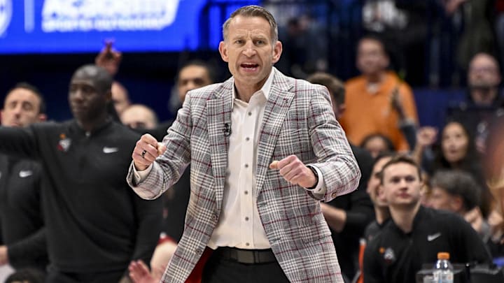 Mar 15, 2025; Nashville, TN, USA;  Alabama Crimson Tide head coach Nate Oats cheers after a made basket against the Florida Gators during the first half at Bridgestone Arena. Mandatory Credit: Steve Roberts-Imagn Images