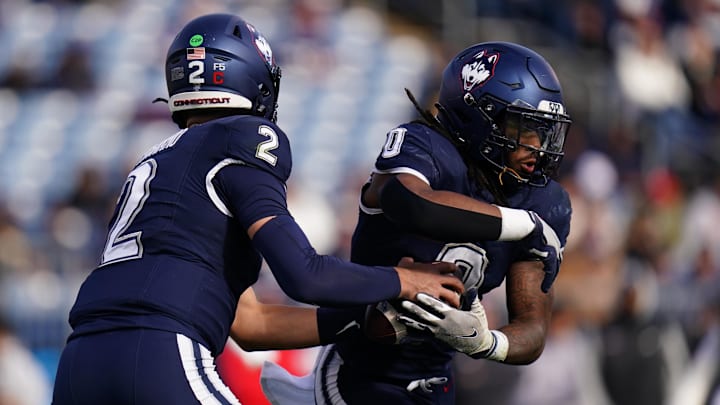 Nov 15, 2025; East Hartford, Connecticut, USA; UConn Huskies quarterback Joe Fagnano (2) fakes a hand off to running back Cam Edwards (0) the Air Force Falcons in the first half at Pratt & Whitney Stadium at Rentschler Field. Mandatory Credit: David Butler II-Imagn Images Nov 15, 2025; East Hartford, Connecticut, USA; UConn Huskies quarterback Joe Fagnano (2) fakes a hand off to running back Cam Edwards (0) the Air Force Falcons in the first half at Pratt & Whitney Stadium at Rentschler Field. Mandatory Credit: David Butler II-Imagn Images
