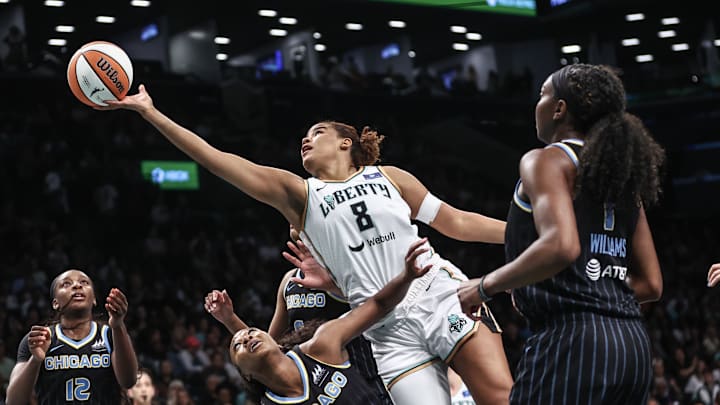May 23, 2024; Brooklyn, New York, USA;  New York Liberty forward Nyara Sabally (8) drives past Chicago Sky guard Dana Evans (11) in the first quarter at Barclays Center. Mandatory Credit: Wendell Cruz-Imagn Images