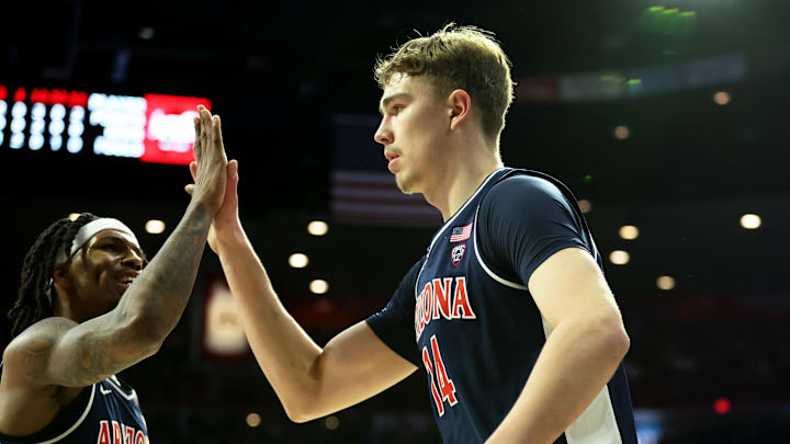 Jan 17, 2024; Tucson, Arizona, USA; Arizona Wildcats center Motiejus Krivas (14) celebrates with guard Caleb Love (2) after a defensive block against the USC Trojans during the first half at McKale Center. Mandatory Credit: Zachary BonDurant-Imagn Images