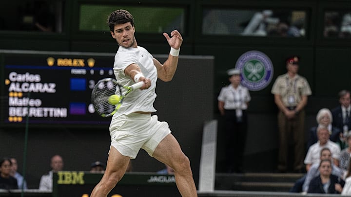 Jul 10, 2023; London, United Kingdom; Carlos Alcaraz (ESP) returns a shot against Matteo Berrettini