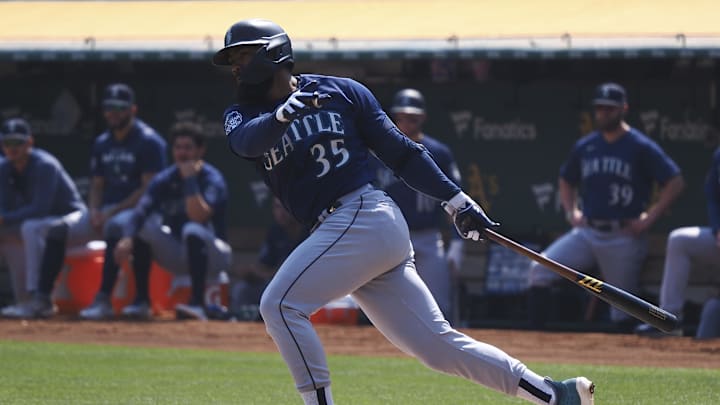 Then-Seattle Mariners designated hitter Teoscar Hernandez (35) hits a single against the Oakland Athletics during the first inning of a game last season.