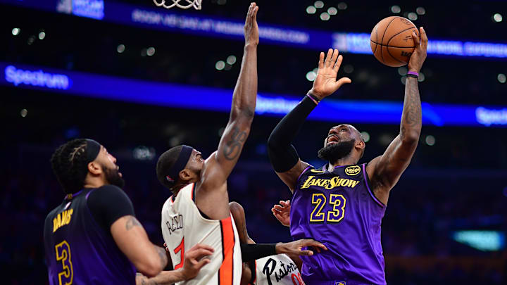 Los Angeles Lakers forward James shoots against Detroit Pistons forward Reed during the second half at Crypto.com Arena. 