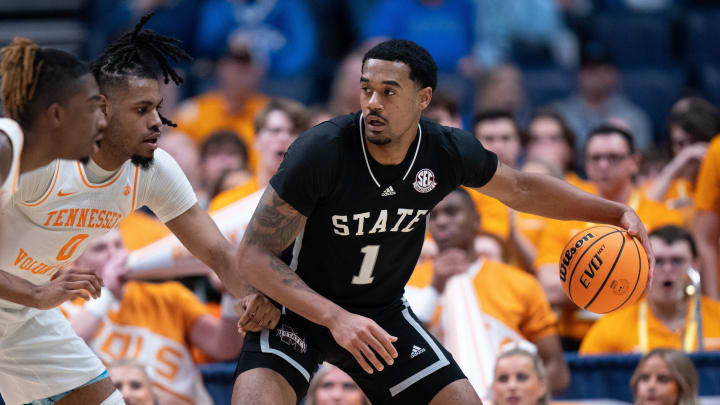 Mississippi State Bulldogs forward Tolu Smith (1) drives against Tennessee Volunteers forward Jonas Aidoo (0) during their SEC Men's Basketball Tournament quarterfinal game at Bridgestone Arena in Nashville, Tenn., Friday, March 15, 2024.