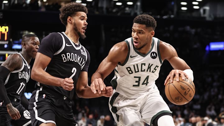 Oct 27, 2024; Brooklyn, New York, USA;  Milwaukee Bucks forward Giannis Antetokounmpo (34) looks to drive past Brooklyn Nets forward Cameron Johnson (2) in the first quarter at Barclays Center. Mandatory Credit: Wendell Cruz-Imagn Images