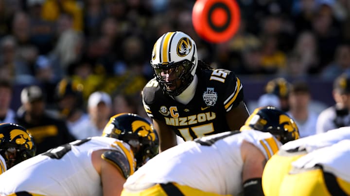 Dec 30, 2024; Nashville, TN, USA;  Missouri Tigers defensive end Johnny Walker Jr. (15) sneaks a peak into the backfield against the Iowa Hawkeyes during the first half at Nissan Stadium. Mandatory Credit: Steve Roberts-Imagn Images