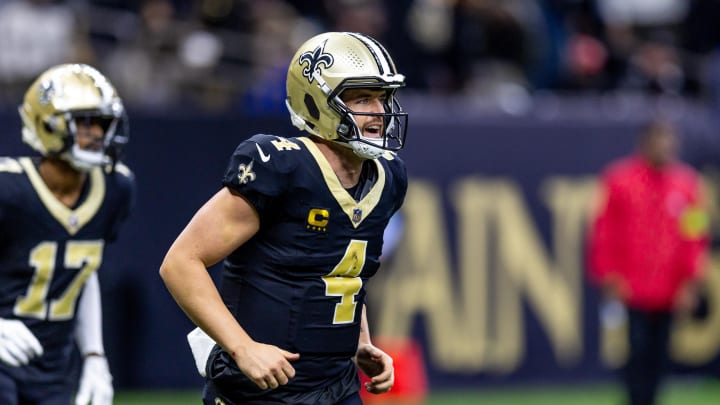Jan 7, 2024; New Orleans, Louisiana, USA; New Orleans Saints quarterback Derek Carr (4) celebrates a touchdown pass against the Atlanta Falcons during the second half at Caesars Superdome. Mandatory Credit: Stephen Lew-USA TODAY Sports Jan 7, 2024; New Orleans, Louisiana, USA; New Orleans Saints quarterback Derek Carr (4) celebrates a touchdown pass against the Atlanta Falcons during the second half at Caesars Superdome. Mandatory Credit: Stephen Lew-USA TODAY Sports