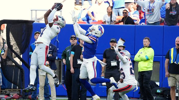 Oct 4, 2026; Orchard Park, New York, USA; New England Patriots safety Craig Woodson (4) intercepts a pass intended Buffalo Bills wide receiver Josh Palmer (5) during the fourth quarter for at New Highmark Stadium. Oct 4, 2026; Orchard Park, New York, USA; New England Patriots safety Craig Woodson (4) intercepts a pass intended Buffalo Bills wide receiver Josh Palmer (5) during the fourth quarter for at New Highmark Stadium.