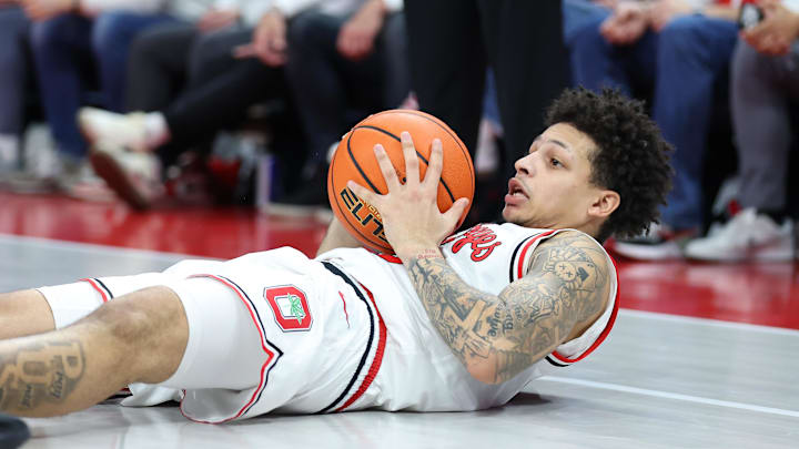 Mar 1, 2026; Columbus, Ohio, USA; Ohio State Buckeyes guard John Mobley Jr. (0) saves the ball during the first half against the Purdue Boilermakers at Value City Arena. Mandatory Credit: Joseph Maiorana-Imagn Images Mar 1, 2026; Columbus, Ohio, USA; Ohio State Buckeyes guard John Mobley Jr. (0) saves the ball during the first half against the Purdue Boilermakers at Value City Arena. Mandatory Credit: Joseph Maiorana-Imagn Images