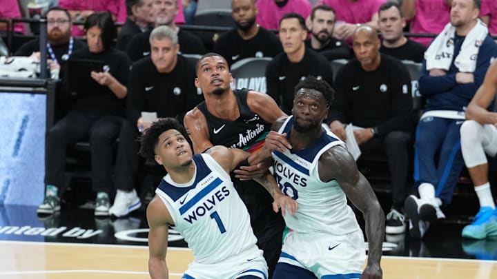 May 4, 2026; San Antonio, Texas, USA; Minnesota Timberwolves guard Terrence Shannon Jr. (1) and forward Julius Randle (30) block out San Antonio Spurs forward Victor Wembanyama (1) in the first half during game one of the second round of the 2026 NBA Playoffs at Frost Bank Center. Mandatory Credit: Daniel Dunn-Imagn Images