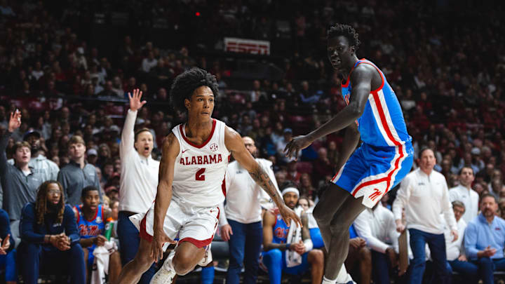 Jan 14, 2025; Tuscaloosa, Alabama, USA; Alabama Crimson Tide guard Aden Holloway (2) drives the ball against Mississippi Rebels forward John Bol (10) during the first half at Coleman Coliseum. Mandatory Credit: Will McLelland-Imagn Images Jan 14, 2025; Tuscaloosa, Alabama, USA; Alabama Crimson Tide guard Aden Holloway (2) drives the ball against Mississippi Rebels forward John Bol (10) during the first half at Coleman Coliseum. Mandatory Credit: Will McLelland-Imagn Images