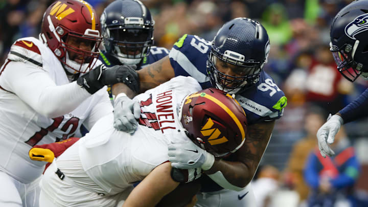 Nov 12, 2023; Seattle, Washington, USA; Seattle Seahawks defensive end Leonard Williams (99) sacks Washington Commanders quarterback Sam Howell.