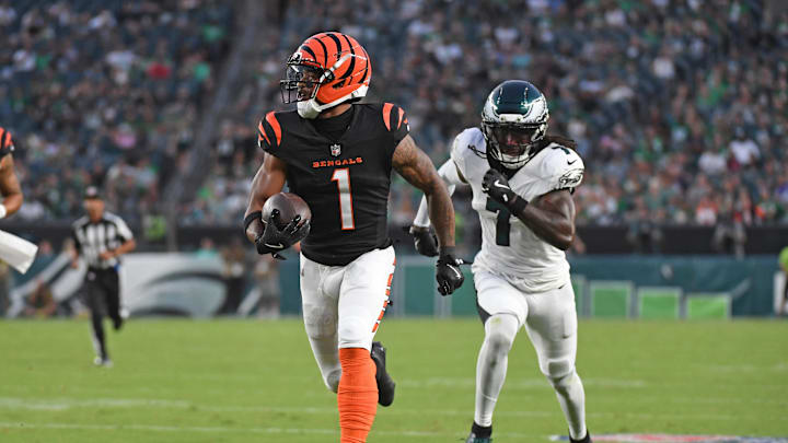 Aug 7, 2025; Philadelphia, Pennsylvania, USA; Cincinnati Bengals wide receiver Ja'Marr Chase (1) runs past Philadelphia Eagles cornerback Kelee Ringo (7) on a 36-yard touchdown catch during the first quarter against the Philadelphia Eagles at Lincoln Financial Field. Mandatory Credit: Eric Hartline-Imagn Images