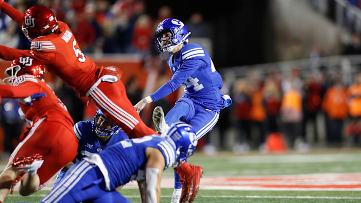 BYU's Will Ferrin kicks the football against Utah