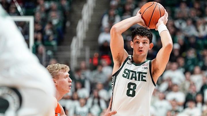 Michigan State forward Frankie Fidler (8) makes a pass against Bowling Green forward Youssef Khayat (23) during the first half at Breslin Center in East Lansing on Saturday, Nov. 16, 2024.