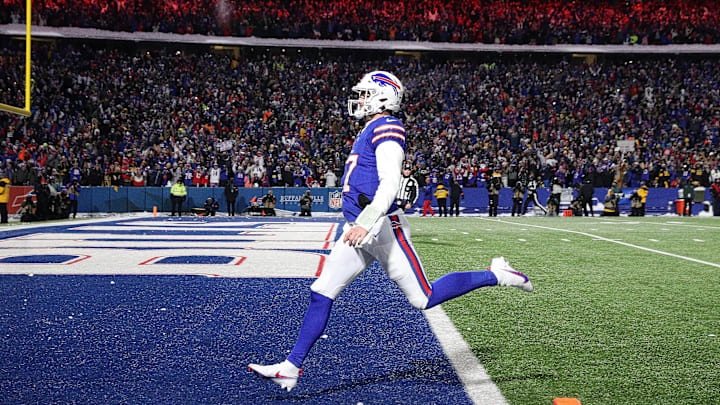 Buffalo Bills quarterback Josh Allen (17) runs into the end zone on this 52 yard run.