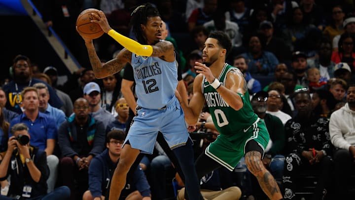 Nov 7, 2022; Memphis, Tennessee, USA; Memphis Grizzlies guard Ja Morant (12) and Boston Celtics forward Jayson Tatum (0) during the second half at FedExForum. Mandatory Credit: Petre Thomas-Imagn Images
