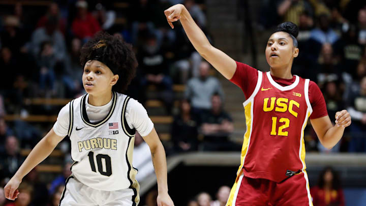 USC Trojans guard JuJu Watkins (12) reacts after shooting the ball past Purdue Boilermakers guard Jordyn Poole (10) and scoring Wednesday, Jan. 22, 2025, during the NCAA women’s basketball game at Mackey Arena in West Lafayette, Ind. USC Trojans won 79-37. USC Trojans guard JuJu Watkins (12) reacts after shooting the ball past Purdue Boilermakers guard Jordyn Poole (10) and scoring Wednesday, Jan. 22, 2025, during the NCAA women’s basketball game at Mackey Arena in West Lafayette, Ind. USC Trojans won 79-37.