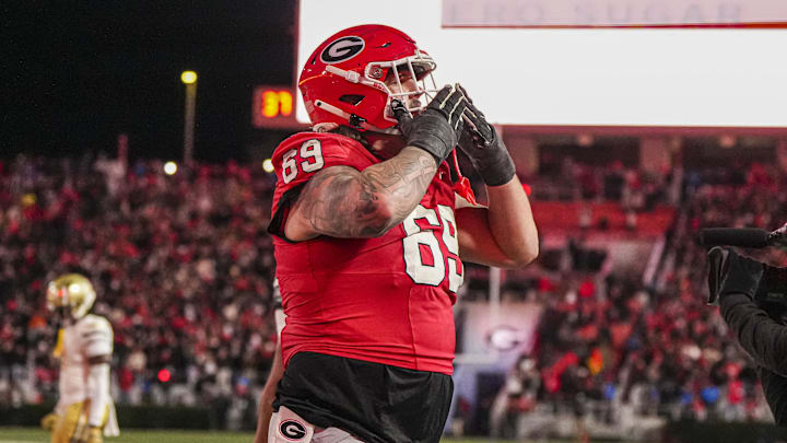 Nov 29, 2024; Athens, Georgia, USA; Georgia Bulldogs offensive lineman Tate Ratledge (69) reacts after a touchdown against the Georgia Tech Yellow Jackets during overtime at Sanford Stadium. Mandatory Credit: Dale Zanine-Imagn Images Nov 29, 2024; Athens, Georgia, USA; Georgia Bulldogs offensive lineman Tate Ratledge (69) reacts after a touchdown against the Georgia Tech Yellow Jackets during overtime at Sanford Stadium. Mandatory Credit: Dale Zanine-Imagn Images
