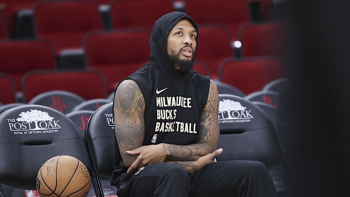 Jan 6, 2024; Houston, Texas, USA; Milwaukee Bucks guard Damian Lillard (0) sits in the bench area before the game against the Houston Rockets at Toyota Center. Mandatory Credit: Troy Taormina-Imagn Images