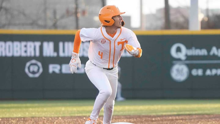Tennessee infielder Manny Marin (4) runs to third while keeping his eye on the ball at the Tennessee baseball season opener against Hofstra, in Lindsey Nelson Stadium at University of Tennessee in Knoxville, Tenn., Friday, February. 14, 2025.