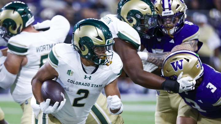 Aug 30, 2025; Seattle, Washington, USA; Colorado State Rams running back Jalen Dupree (2) rushes against the Washington Huskies during the first quarter at Husky Stadium. Mandatory Credit: Joe Nicholson-Imagn Images