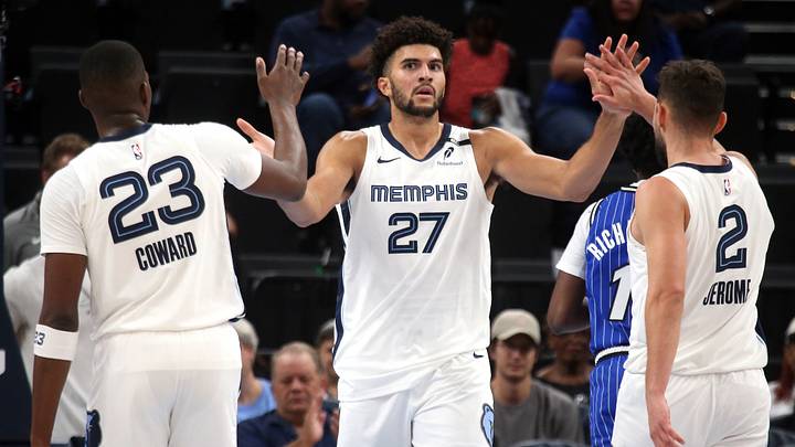 Oct 7, 2026; Memphis, Tennessee, USA;  Memphis Grizzlies forward Cameron Boozer (27) reacts with forward Cedric Coward (23) and guard Ty Jerome (2) during the second quarter against the Orlando Magic at FedExForum.  Mandatory Credit: Petre Thomas-Imagn Images