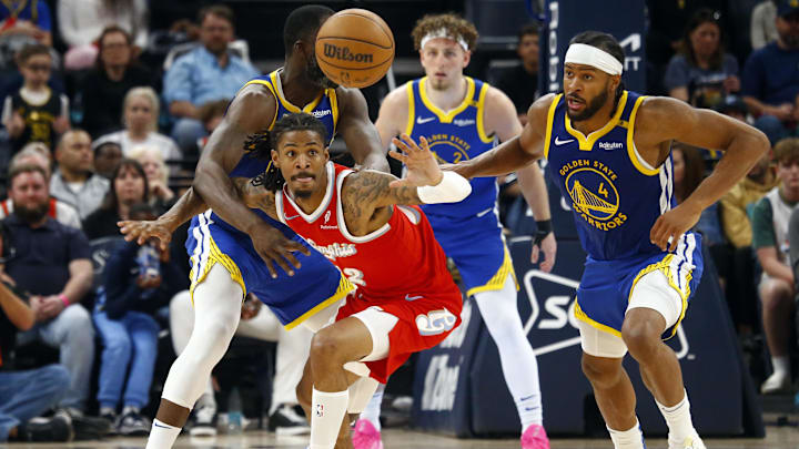 Apr 1, 2025; Memphis, Tennessee, USA; Memphis Grizzlies guard Ja Morant (12) loses control of the ball as Golden State Warriors forward Draymond Green (23) and Golden State Warriors guard Moses Moody (4) defend during the fourth quarter at FedExForum. Mandatory Credit: Petre Thomas-Imagn Images Apr 1, 2025; Memphis, Tennessee, USA; Memphis Grizzlies guard Ja Morant (12) loses control of the ball as Golden State Warriors forward Draymond Green (23) and Golden State Warriors guard Moses Moody (4) defend during the fourth quarter at FedExForum. Mandatory Credit: Petre Thomas-Imagn Images