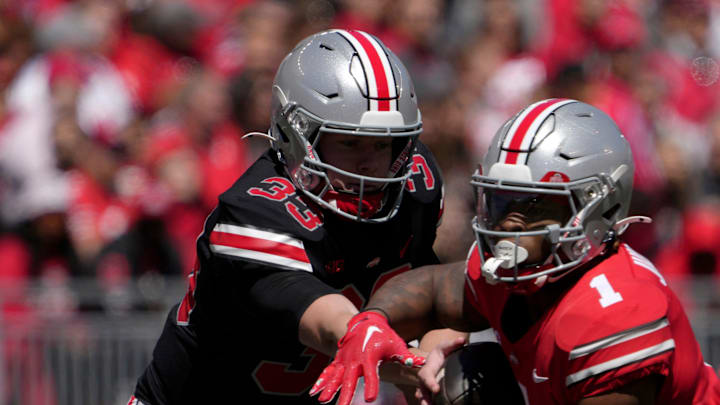 April 13, 2024; Columbus, Ohio, USA; 
Ohio State Buckeyes quarterback Devin Brown (33) hands off to