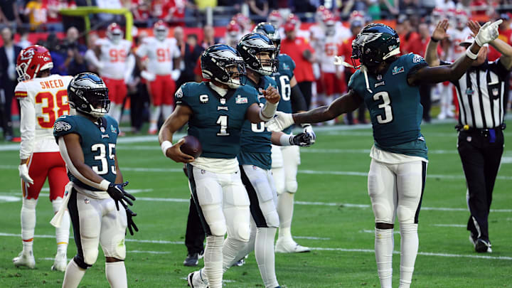 Feb 12, 2023; Glendale, Arizona, US; Philadelphia Eagles quarterback Jalen Hurts (1) celebrates with running back Boston Scott (35) and wide receiver Zach Pascal (3) after scoring a touchdown against the Kansas City Chiefs in the first quarter of Super Bowl LVII at State Farm Stadium. Mandatory Credit: Bill Streicher-Imagn Images