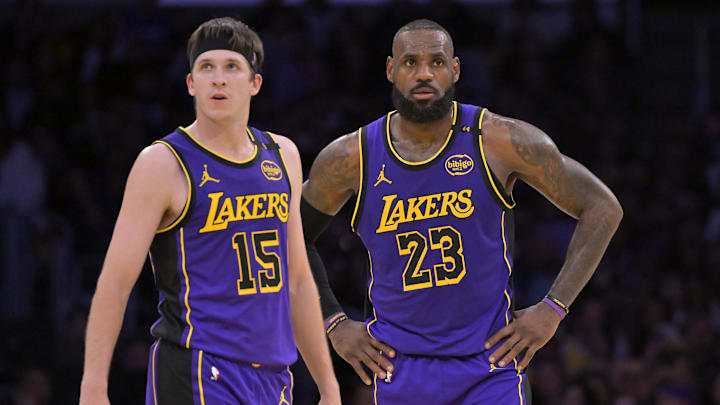 Jan 17, 2025; Los Angeles, California, USA;  Los Angeles Lakers guard Austin Reaves (15) and forward LeBron James (23) talk on the court against the Brooklyn Nets at Crypto.com Arena. Mandatory Credit: Jayne Kamin-Oncea-Imagn Images