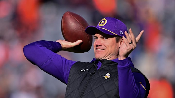 Nov 24, 2024; Chicago, Illinois, USA; Minnesota Vikings head coach Kevin O'Connell throws a pass before the game against the Chicago Bears at Soldier Field. Mandatory Credit: Daniel Bartel-Imagn Images