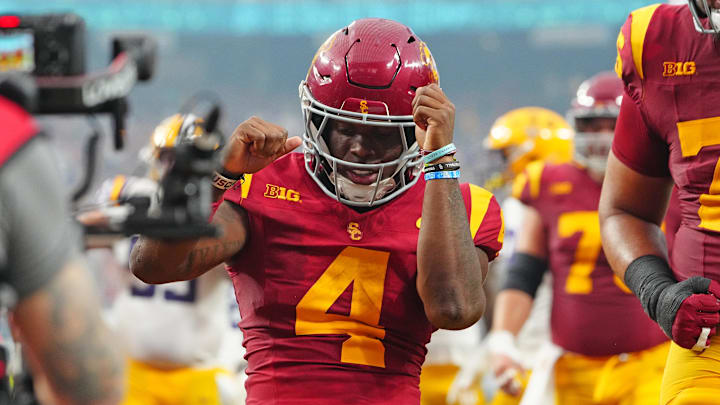 Sep 1, 2024; Paradise, Nevada, USA; Southern California Trojans running back Woody Marks (4) celebrates after scoring a touchdown against the LSU Tigers during the second quarter at Allegiant Stadium. Mandatory Credit: Stephen R. Sylvanie-Imagn Images