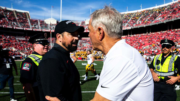 Ohio State head coach Ryan Day, left, shakes hands with Iowa head coach Kirk Ferentz after a NCAA football game, Saturday, Oct. 22, 2022, at Ohio Stadium in Columbus, Ohio.